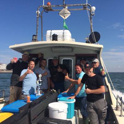 Boot met vissers tijdens dagje wrakvissen Zeeland Boot met vissers tijdens dagje wrakvissen Zeeland